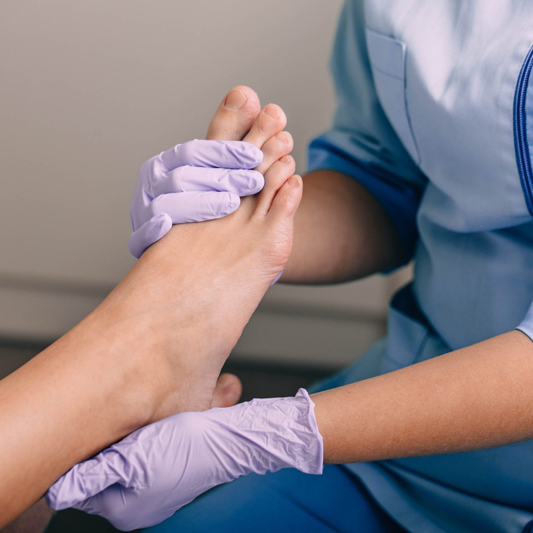 A cosmetologist performs a foot massage, promoting relaxation and skin care while ensuring client comfort and satisfaction