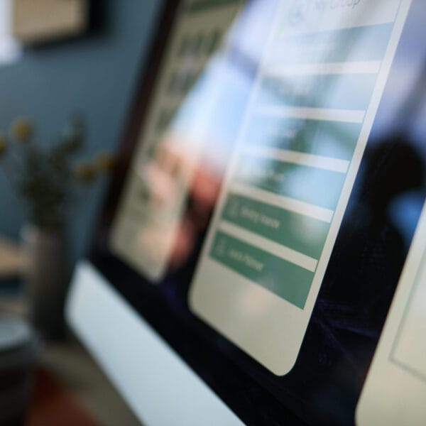 Close up of Computer Monitor Displaying User Interface Design in Office creazione siti web professionali