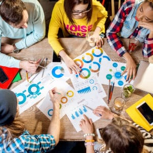 Group of people working together in the cafe Contatti Agenzia Web Ragusa