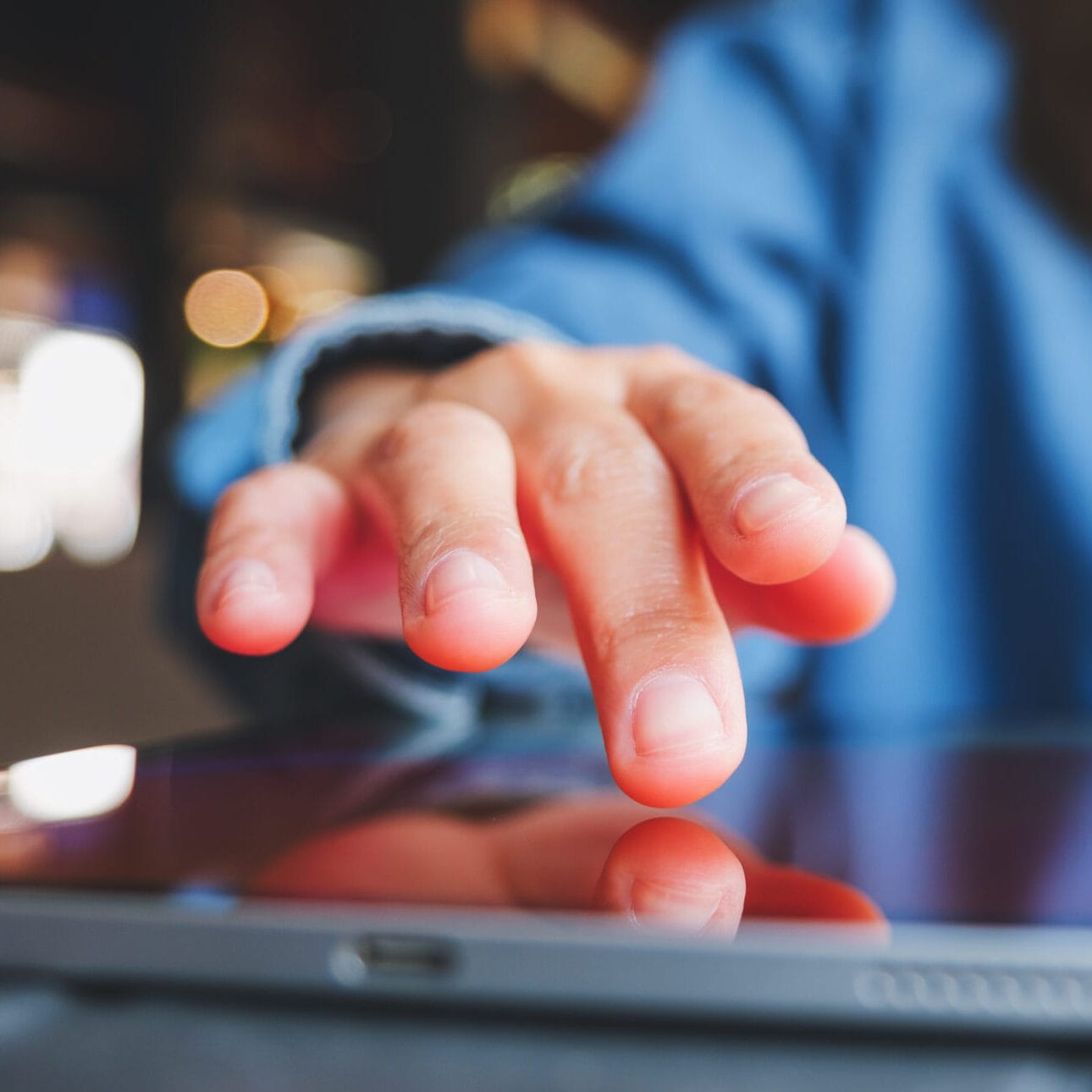 Closeup image of a hand touching on digital tablet screen menu digitale QR code