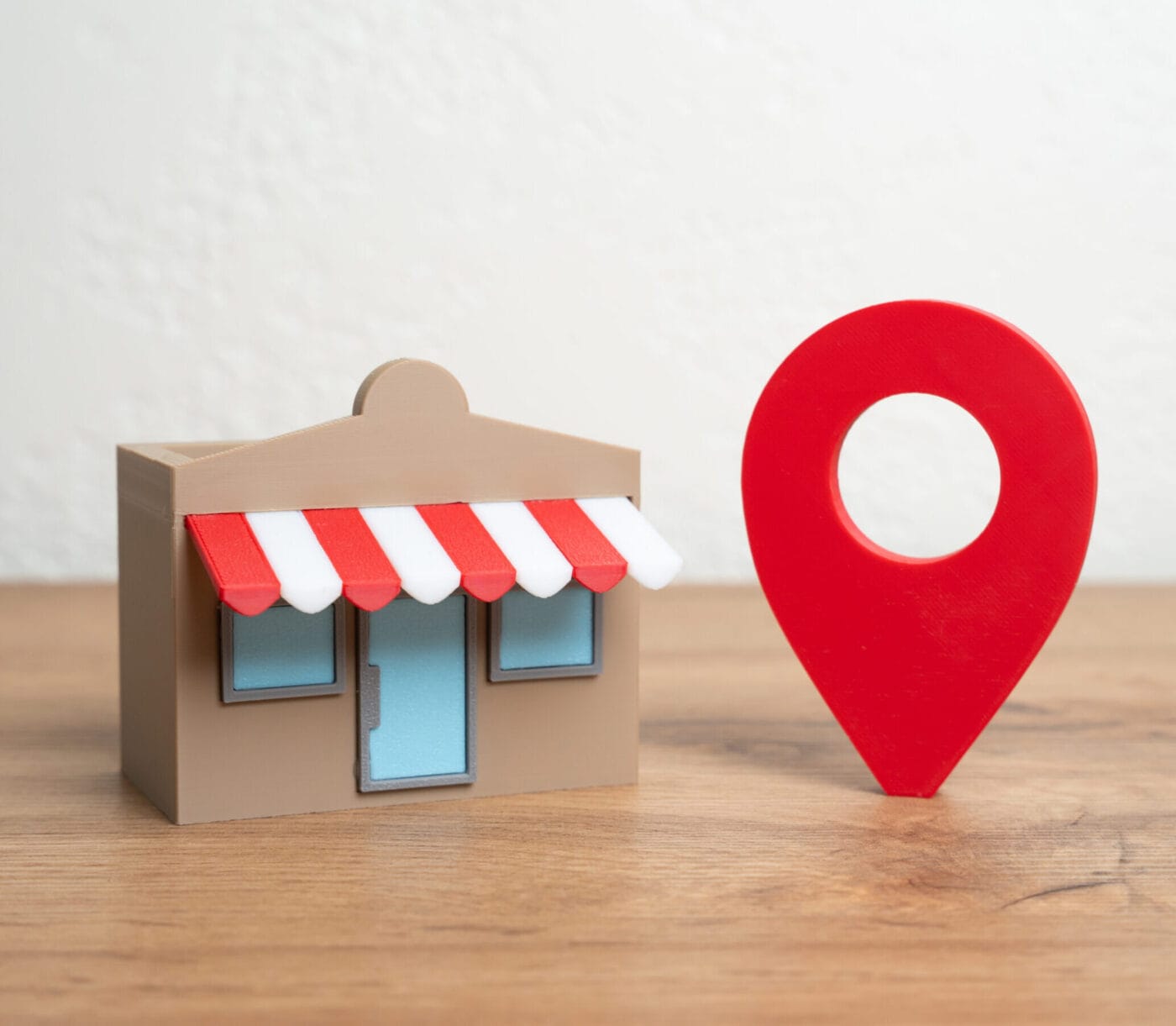 Shop and red geolocation sign. Advertising and presenting your business on maps visibilità siti